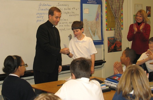 Fr. Timothy Birney presents holy card to Ian Gappy