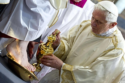 POPE WASHES FOOT OF PRIEST DURING HOLY THURSDAY MASS IN ROME