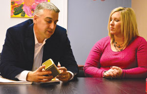 Mathew and Rachel Martino talk about their small faith-themed tea business, Catholici-TEA, at the Faith@Work bookstore in Troy, where their “Holy See-lections” are on display.  