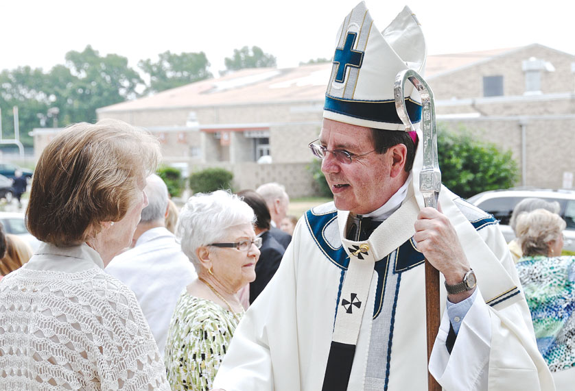 Archbishop Vigneron greets a parishioner at St. Regis Parish in Bloomfield Hills last year. Speaking about the beatification cause for Ven. Solanus Casey, the archbishop said it’s “looking very good,” and added he hopes it will take place within the next five years. 