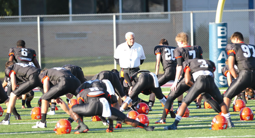 Coach Al Fracassa leads his team in warmups before a game earlier this season. 