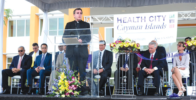 Archbishop Vigneron reads a blessing at the Feb. 25 dedication and grand opening of Health City, a new specialized health care facility in the Cayman Islands. 