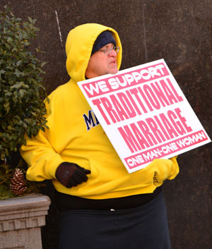 As the trial gets under way Feb. 25, people hold signs and march in front of the federal courthouse in downtown Detroit. 