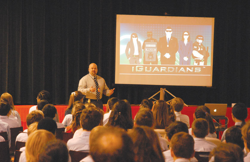 Senior special agent Michael J. Ball introduces St. Regis students, faculty and parents to the Project iGuardian program, which is focused on keeping kids safe online. 