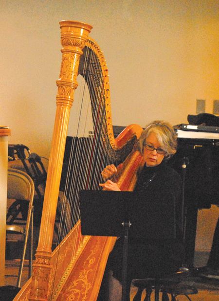 A harpist accompanies the choir during St. Gerald Parish’s 50th anniversary Mass on May 18. For more photos, visit gallery.themichigancatholic.com.