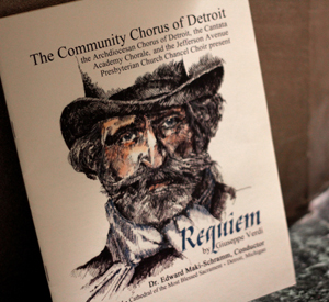A program for the performance lies beside a pew. 