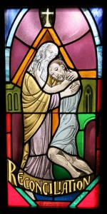 A stained-glass window illustrating the sacrament of reconciliation is seen at Our Lady of Ostrabrama Church in Cutchogue, N.Y. (CNS photo)