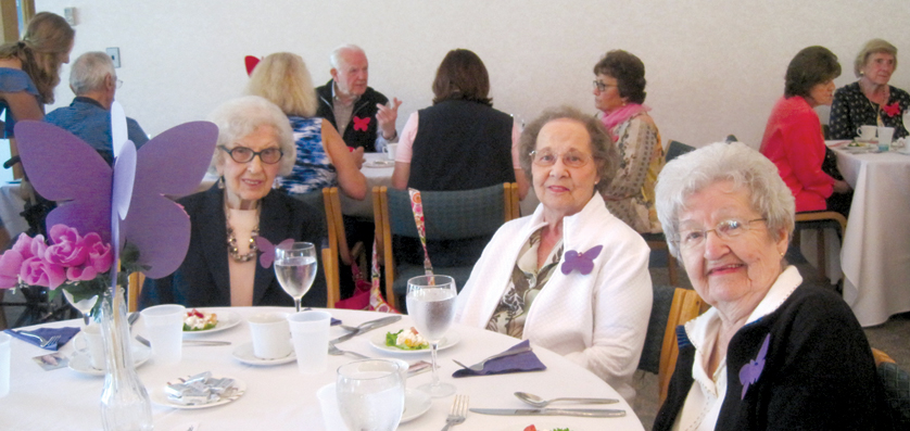 Fox Manor independent living seniors Mary Merlo, Elizabeth Kish and Audrie Bannasch participate at a reception at St. Hugo of the Hills Parish in Bloomfield Hills. 