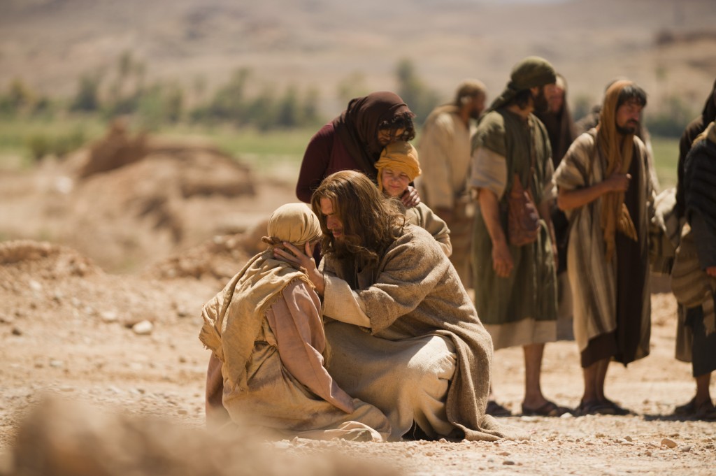 Jesus comforts the woman caught in adultery in the 2014 film "Son of God." (Fox)