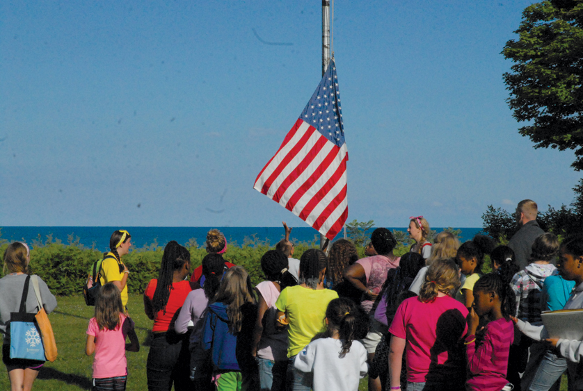 After dinner, but before evening activities commence, campers lower the flag. 
