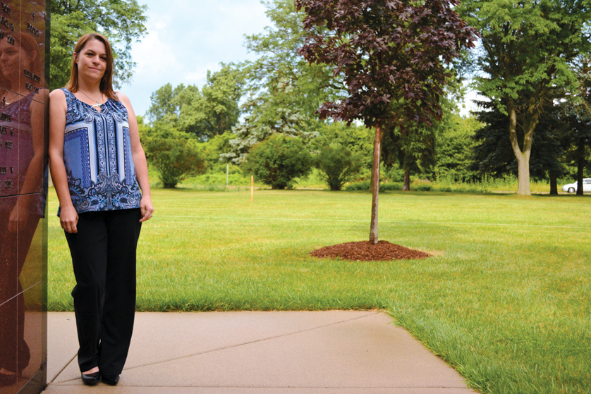 Tracie Mantay, location manager for Our Lady of Hope Cemetery in Brownstown Township, stands near the area where 164 unclaimed deceased from Wayne County will be buried with help from the Archdiocese of Detroit and others. A walkway will be extended into the section, and a memorial will be placed in its center.  