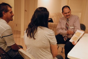 Jose Ocampo, a natural family planning instructor from Indianapolis, introduces Metro Detroit couple, Salvador and Alma Mendez, to the Creighton Model of NFP. (Elizabeth Wong Barnstead, The Michigan Catholic)