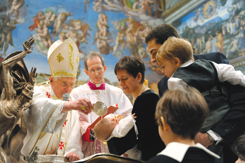 Pope Benedict XVI baptizes a baby during a Mass in the Sistine Chapel at the Vatican Jan. 10. The pope baptized 14 infants, calling it a "great day for these children." (CNS photo/L'Osservatore Romano via Reuters) (Jan. 11, 2010) See POPE-BAPTISMS Jan. 11, 2010.