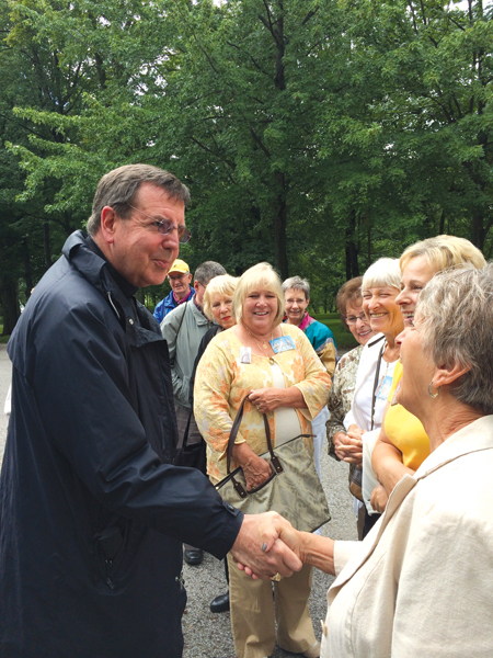 In a twist of providence, Archbishop Allen Vigneron encounters fellow pilgrims from the Archdiocese of Detroit who didn’t travel with the archbishop’s group, but bumped into the group while in Quebec. 