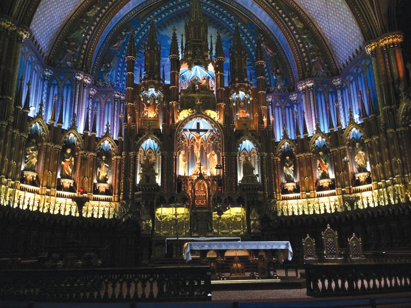 The high altar of the Notre Dame Basilica of Montreal is seen brilliantly illumined during the pilgrims’ visit. 