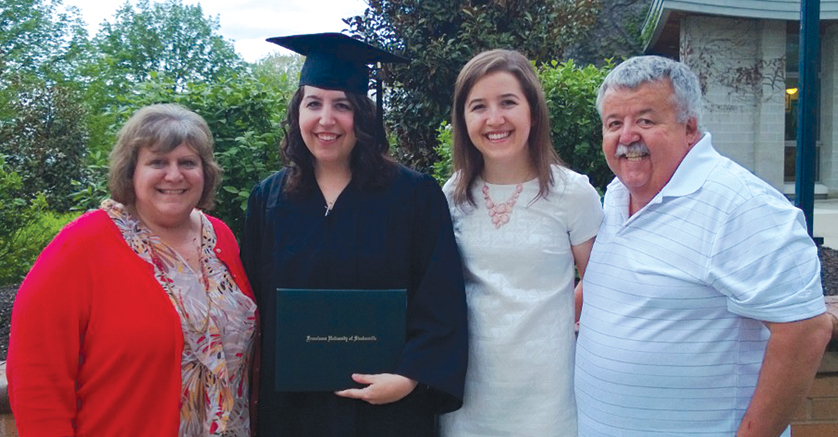 Ashley Hursin celebrates her May 2014 graduation from Franciscan University of Steubenville in Ohio with her mother, Patricia; sister, Lisa; and father, Alonzo. Hursin, a young adult from Dearborn, plays to go to Canada for a year to share the Gospel with youth.