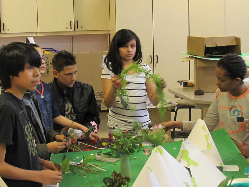 Left to right, Jeovanni Jimenez, Ignacio Nanez, Nicolas Perales, Rosalinda Jimenez and Tyler Burns work on the landscape to their continent during Holy Redeemer Grade School’s “Continent of Imagination” project based on Catholic social teachings. 