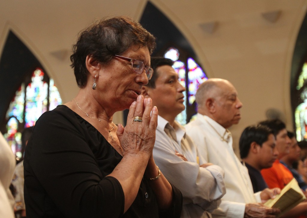 A woman prays during a Mass at Our Lady of Sorrows Church in the Corona neighborhood of the New York borough of Queens Sept. 8. (CNS photo/Gregory A. Shemitz) 