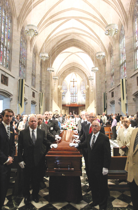 Pall bearers escort the casket of Cardinal Edmund C. Szoka to the back of the Cathedral of the Most Blessed Sacrament in Detroit for the cardinal’s funeral Mass Aug. 26. More than 800 members of the faithful, 80 priests and 30 bishops attended for the liturgy. 