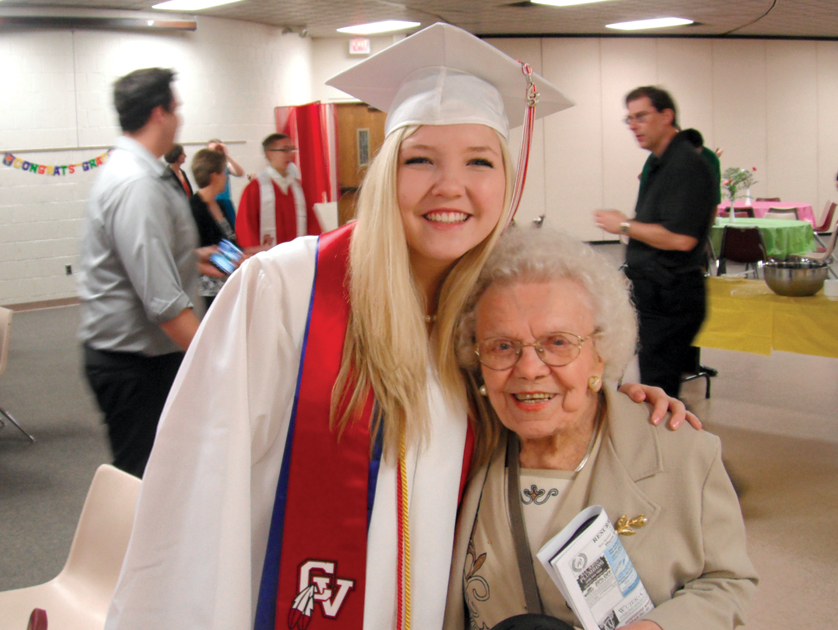 Leona Kwash, 94, a parishioner of St. Michael Parish in Sterling Heights, smiles at the June 16 high school graduation of Carolyn Andre, whose family drives Kwash to Mass most weeks. Through the Andres’ volunteering, the family has developed a special relationship with Kwash, who called them “the most wonderful family in the world.” 