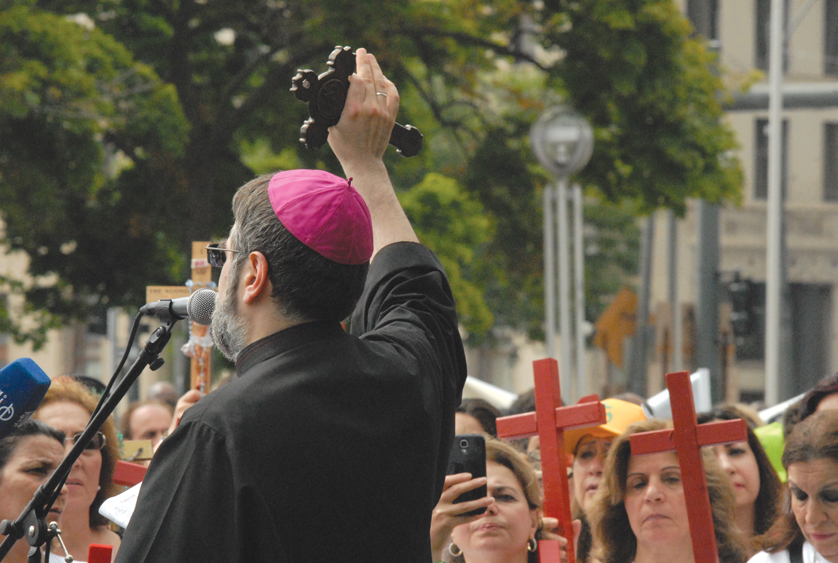 Chaldean Bishop Francis Kalabat addresses those gathered in Detroit on Aug. 22 to pray and rally in support of Christians suffering in Iraq. 