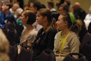 Young people listen intently during the youth track portion of the Call to Holiness conference.
