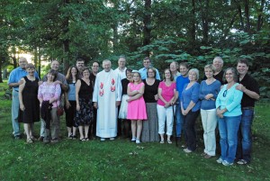 The couples of "Christian Marrieds" group: Marc and Leona Center; Tom and Karen Hejka; Joe and Karen Wainz; Chuck and JoAnn Twigg; Fr. Prus; Bill and Linda Hughes with their daughter, Clara; Tom and Sandy O’Hara; Ralph and Lynn Wittla; Mark and Lisa Ludeman; Roy and Holly Ruhle; Ken and Carol McCloskey.