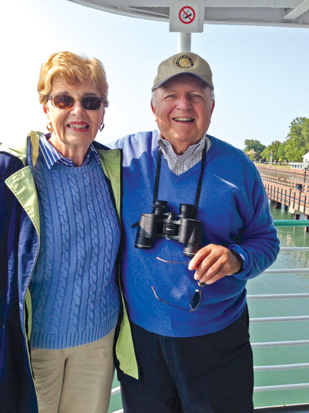 John C. Prost, who owns an insurance company in St. Clair Shores, stands with his wife, Lucy. Prost said the Catholic ethic of honesty informs his business decisions as well. 