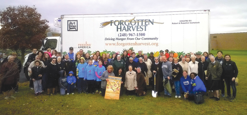 Volunteers gathered and donated nearly 800 pounds of apples Oct. 18 from an orchard at Ladywood High School for Forgotten Harvest. 