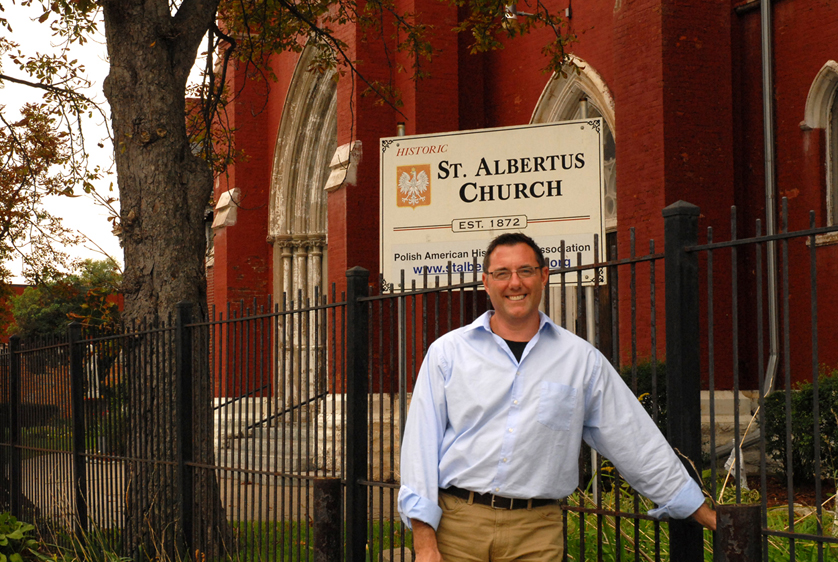 Robert Mowry, author of “Years of Faith: The Ethnic Heritage and History of Ten Catholic Parishes of Detroit,” stands in front of St. Albertus Church, which recently saw a visit from the Detroit Mass Mob movement. St. Albertus is one of 10 historic parishes profiled in Mowry’s book. 