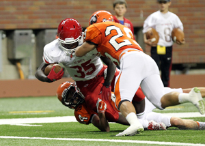 Brother Rice senior Bo Pickens finishes off a tackle on St. Mary’s Prep junior Justin Myrick. Brother Rice won the game in thrilling fashion, 35-28. 