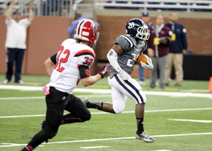Loyola senior Mideyin Wilson runs downfield to score during Loyola’s win over Divine Child. 