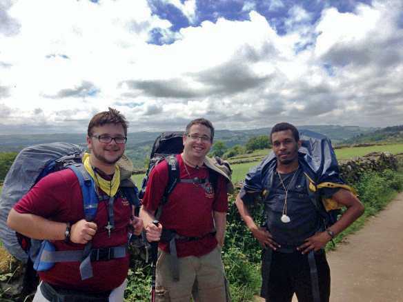 From left, seminarians Josh LaPeer and Tim Wezner, along with fellow pilgrim Kristopher Johnson, stop to reflect along the path during last summer’s Camino pilgrimage in Spain. Along the way, each pilgrim was given the name of two or three donors to pray for in thanksgiving for their pilgrimage. 