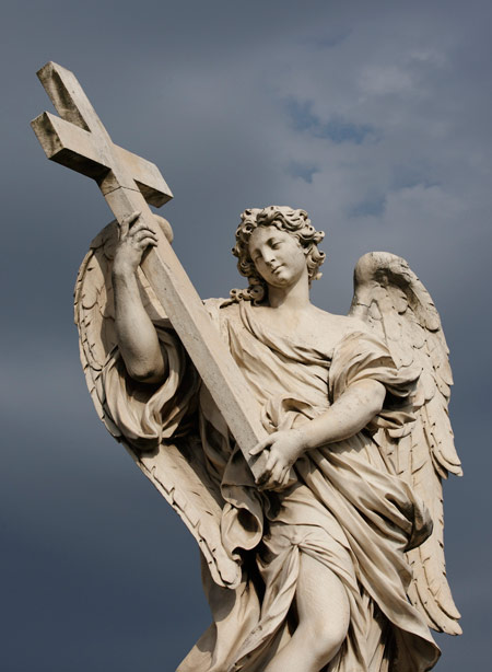 A statue of an angel carrying Christ's cross is seen on the Castel Sant'Angelo bridge in Rome May 12. The 10 angel statues on the bridge each carry an element of Christ's passion. The statues were designed by Gian Lorenzo Bernini and executed by his students in 1688. (CNS photo/Paul Haring) (July 28, 2010)