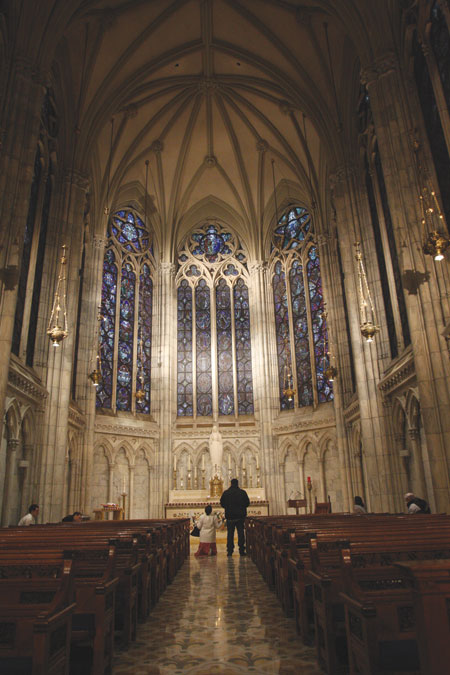 People pray in the Lady Chapel at St. Patrick's Cathedral in New York March 17. The cathedral will undergo a $175 million, five-year restoration project that is necessary for its survival, according to Cardinal Timothy M. Dolan of New York . (CNS photo/Gregory A. Shemitz) (March 19, 2012) See STPATRICKS-RESTORE March 19, 2012.