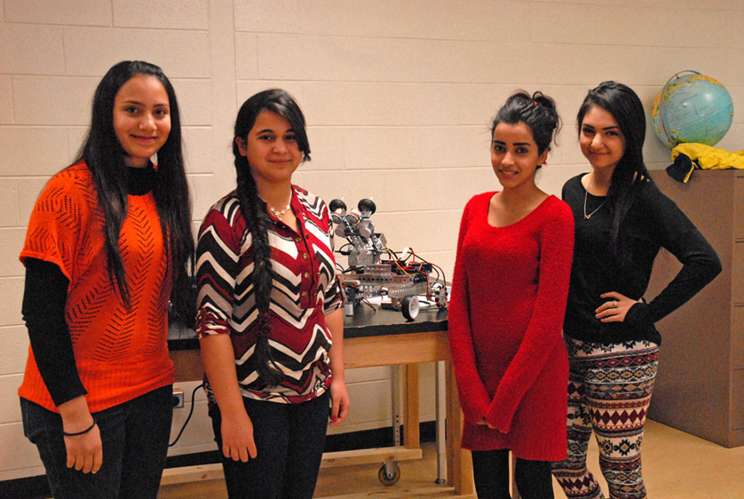 Left to right, Maryam Kafra, Israa Alfadhli, Farah Sabah and Regina Alsabagh attend Wilkinson Middle School in Madison Heights. Two of the girls are Chaldean Catholic, one is Muslim and one is Baptist, but all have become close friends over their shared science project and background as refugees, despite their religious differences. 