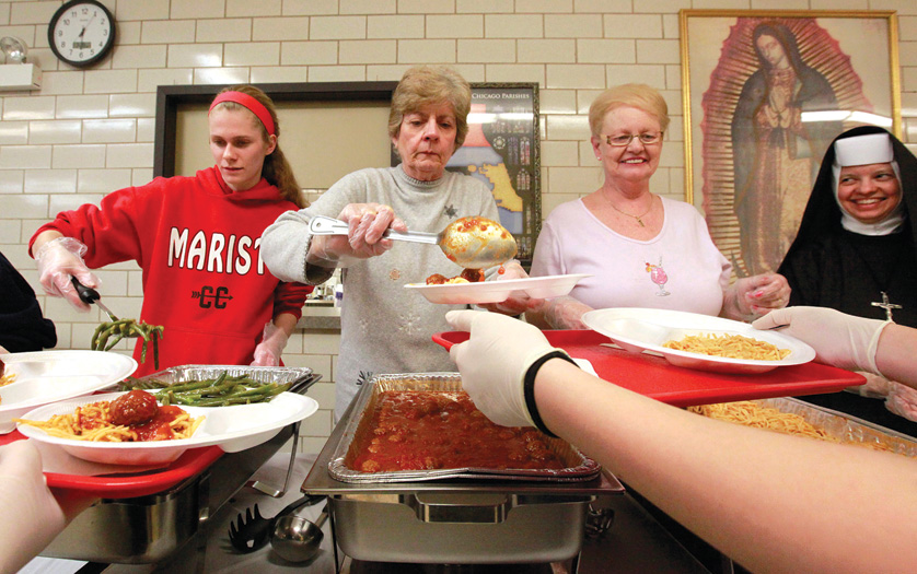 Volunteers serve food cooked by nuns and other volunteers in late February in the Wednesday Soup Kitchen at St. Blase Parish in Argo Summit, Ill. A faith-based coalition called Circle of Protection, which includes the U.S. Conference of Catholic Bishops, has been urging the federal government to not cut funding of programs for the poor in the national budget. (CNS photo/Karen Callaway, Catholic New World) (Aug. 11, 2011) See WASHINGTON LETTER Aug. 11, 2011.