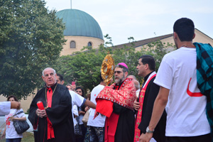 Newly installed Bishop Francis Kalabat leads nearly 1,000 Chaldean Catholics and others Aug. 1 in a eucharistic procession and prayer for peace for persecuted Iraqi Christians at Mother of God Chaldean Church in Southfield.  