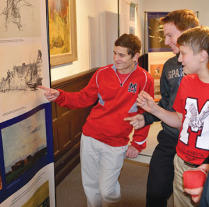 Students in Marzanna Owinski’s Polish language class at Orchard Lake St. Mary’s look at a display at the Art Gallery of The Polish Mission in Orchard Lake.