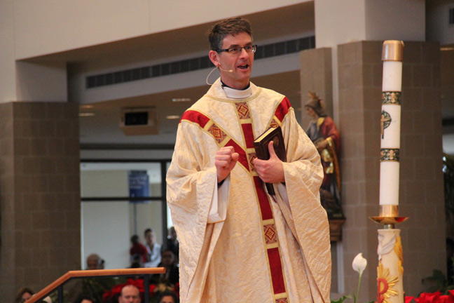 Fr. John Riccardo gives the homily during Our Lady of Good Counsel Parish’s packed Jan. 4 “Welcome Mass” designed for non-practicing friends and family of parishioners and focused on preaching the “kerygma,” or a basic introduction to the Gospel. 