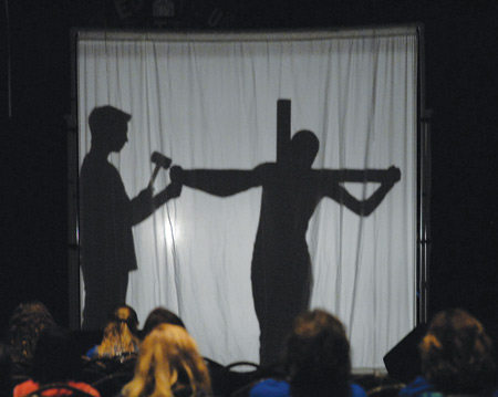 Youths enact “shadow” Stations of the Cross during CYO Rainbow XXXIII Conference in Detroit. See story, Page 5. 