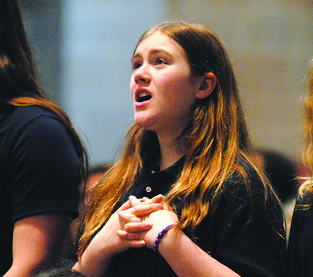 A young member of Counsellor’s Youth Chorale at Our Lady of Good Counsel in Plymouth sings “A Prayer for Humility” by Mark Patterson.  