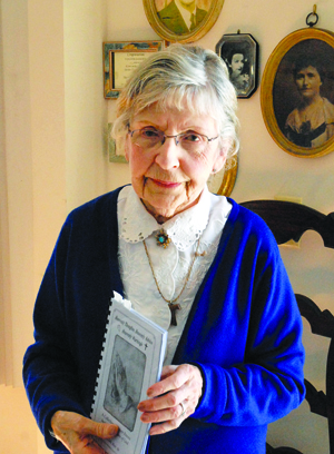 Blair holds a copy of a poetry book she wrote, called “Heavenly Thoughts, Heavenly Advice, Heavenly Warnings.” 