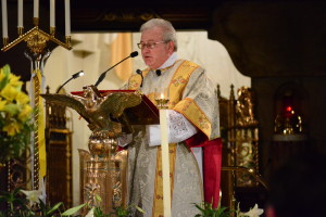 Deacon Thomas Avery reads the official papal decree signed by Cardinal Robert Sarah, former prefect of the Congregation of Divine Worship and the Disciple of the Sacraments, designating the Shrine a minor basilica.