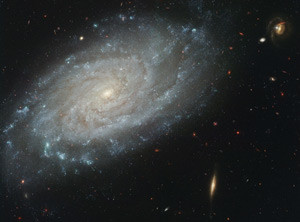 This image from the Hubble Space Telescope shows intricate spiral arms containing areas of new star formation in a dusty galaxy about 100 million light-years away. The former director of the Vatican Observatory, U.S. Jesuit Father George Coyne, said that life emerged on Earth through the process of stars caught in a cycle of collapsing and reforming. (CNS photo/NASA, The Hubble Heritage Team and A. Riess) (June 25, 2009) See ASTRONOMY-UNIVERSE June 25, 2009.