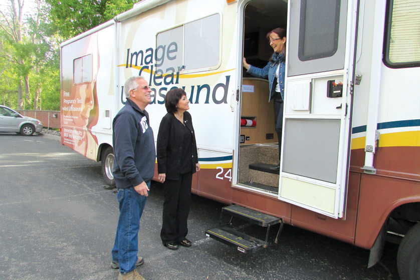 Mobile operations manager Bev Dixon, right, sonographer Marion Sioma and driver Ron Page set off May 21 for the “maiden voyage” of the Image Clear Ultrasound Mobile unit, which will offer free ultrasounds and pregnancy resources in areas of inner-city and Metro Detroit where abortion rates are the highest.