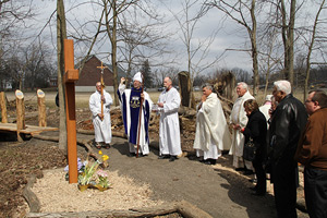 Bishop Michael Byrnes blesses the “15th station” — the Resurrection — in April 2013 along the Stations of the Cross walking pathway created by Eagle Scout Christopher Kehrer at St. Mary Mystical Rose Parish in Armada.