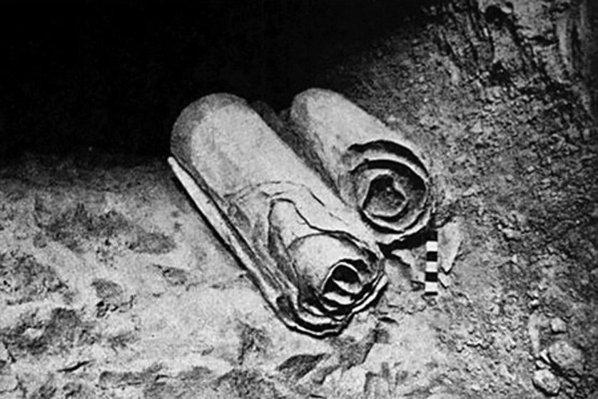 Two of the Dead Sea Scrolls lie at their location in the Qumran Caves before being removed for scholarly examination by archaeologists. 