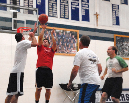 Parishioners of Our Lady of the Lakes in Waterford play basketball to raise money for veterans July 15.