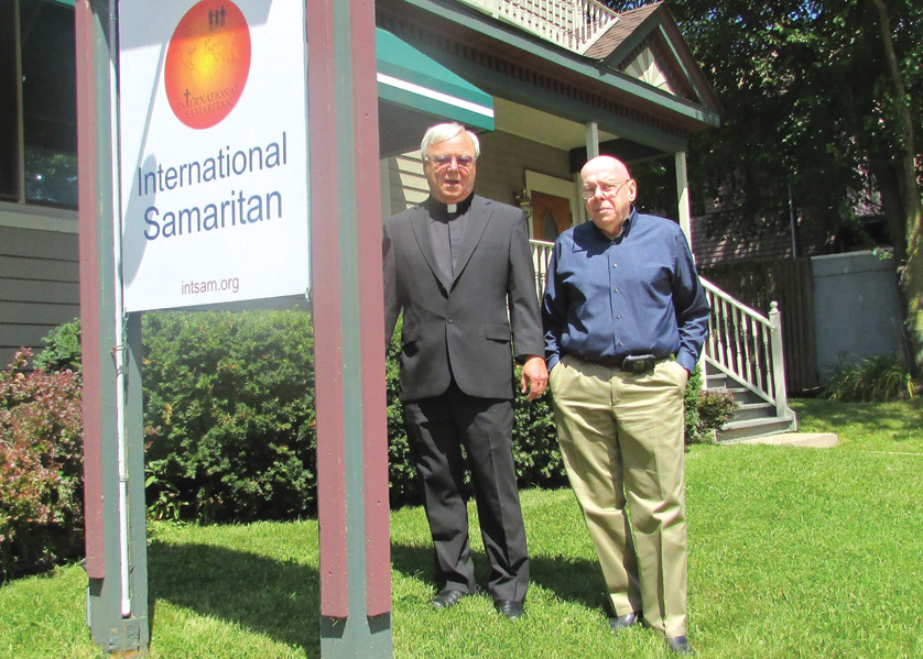 Fr. Don Vettese, SJ and Richard Nye stand outside the International Samartian's headquarters in Ann Arbor. Nye and Fr. Vettese are seeking to open a physical location for Veritas Christi High School, a Catholic school for special-needs students.